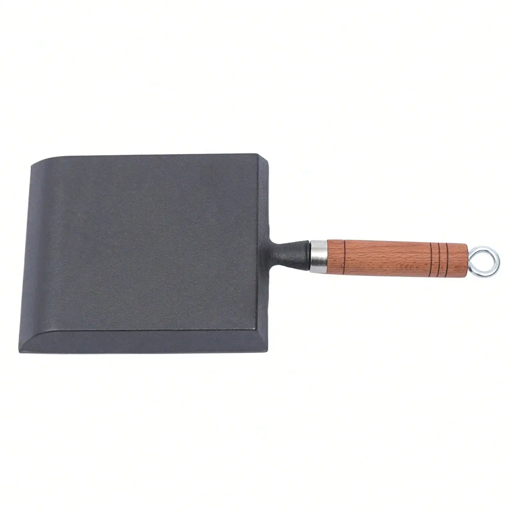 Poêle en fonte en forme de pelle -