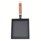 Poêle en fonte en forme de pelle -