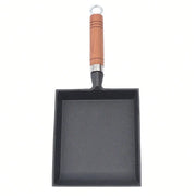 Poêle en fonte en forme de pelle -